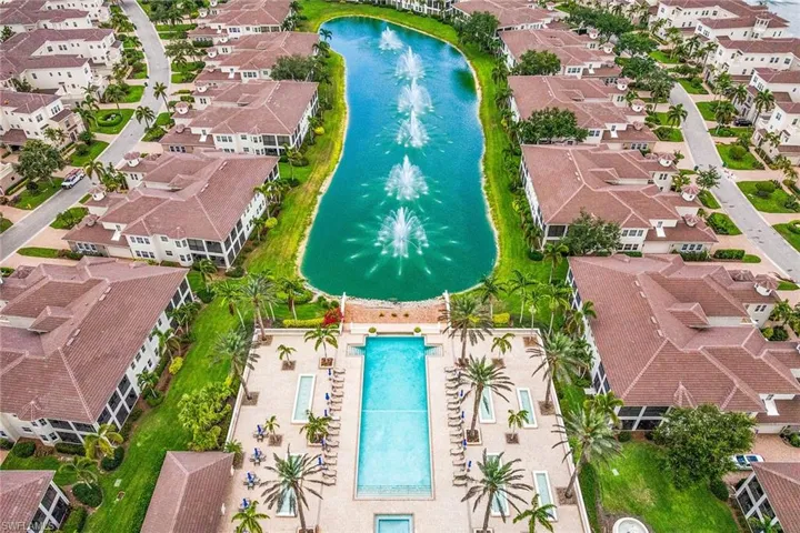 Aerial perspective of suburban area featuring a large body of water