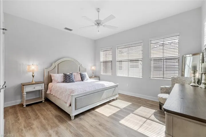 Bedroom featuring light wood-type flooring and a ceiling fan