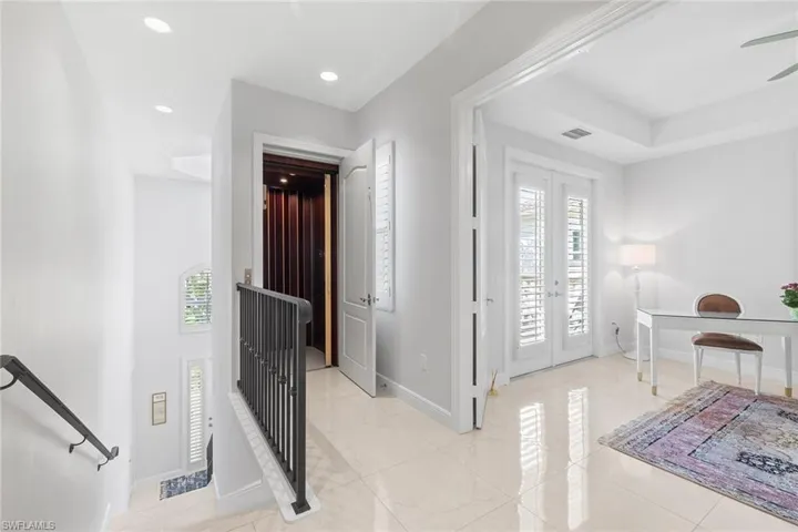 Entryway featuring french doors, light tile patterned flooring, recessed lighting, and a ceiling fan