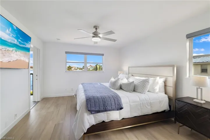 Bedroom featuring wood finished floors and ceiling fan