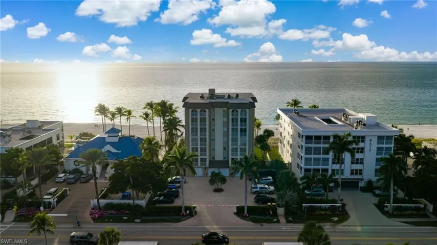 Bird's eye view of a nearby body of water and apartment complex / building