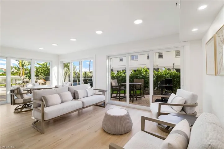 Living room featuring light wood finished floors and recessed lighting