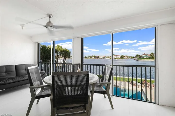 Sunroom with a water view