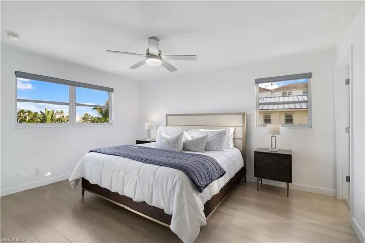 Bedroom featuring wood finished floors and ceiling fan