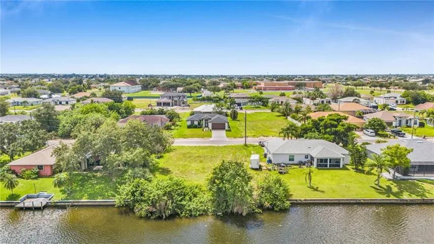 Aerial view of residential area with a large body of water