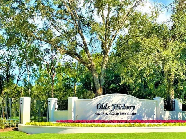 Community sign featuring view of scattered trees