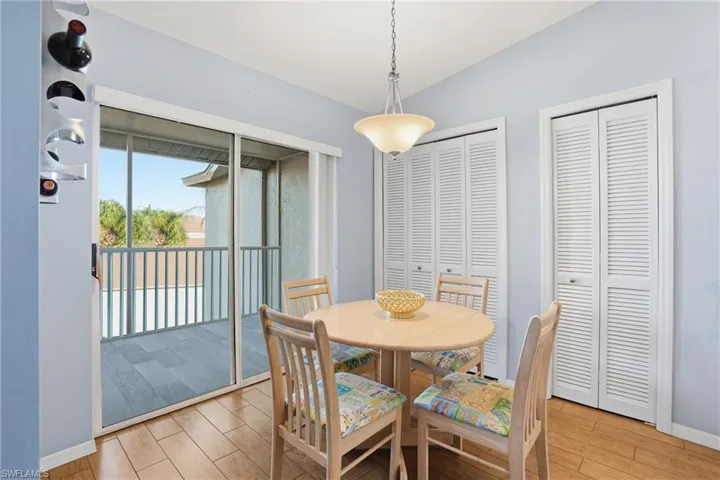 Dining space featuring light wood-style floors and baseboards