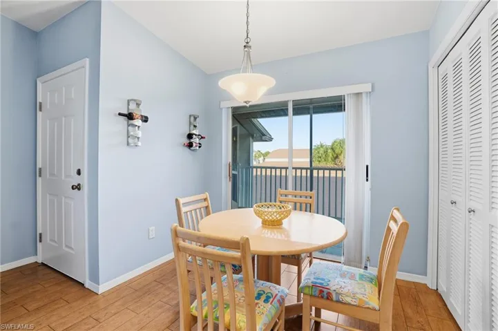 Dining area with baseboards and hardwood / wood-style floors