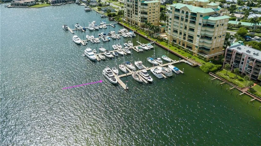 Aerial view of a marina and a nearby body of water