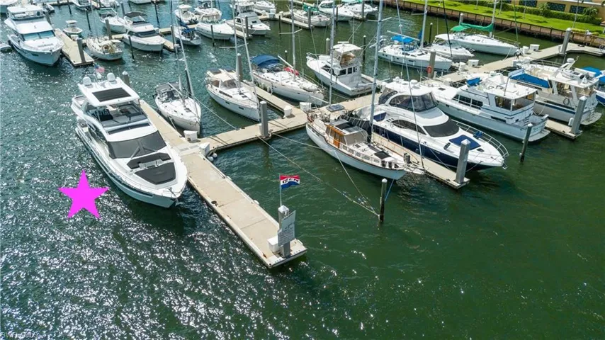 Dock featuring view of marina and a water view