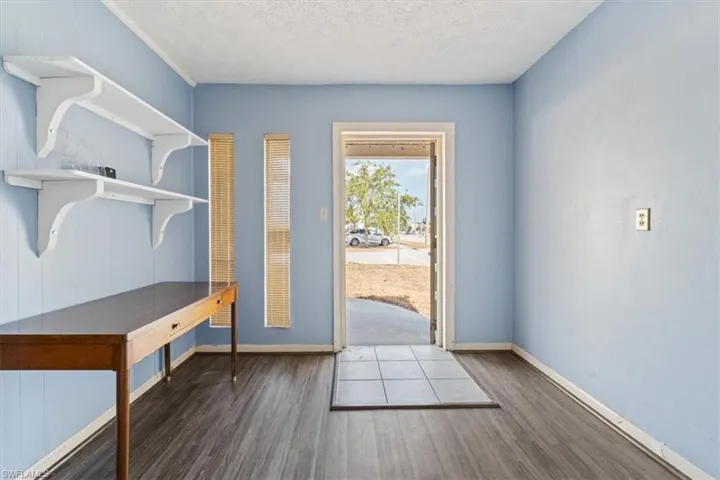 Entryway featuring wood finished floors and a textured ceiling
