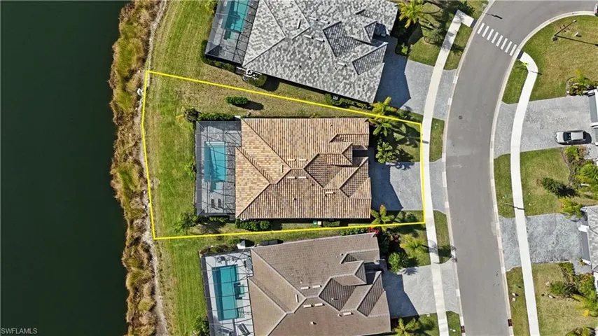 Aerial view of property's location featuring a large body of water and property parcel outlined