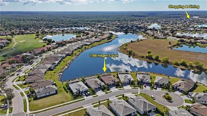 View of property location with nearby suburban area and a large body of water