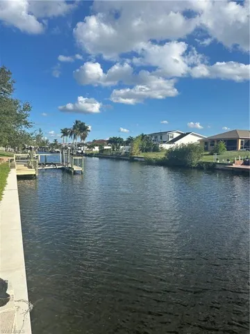 View of water feature with a boat dock