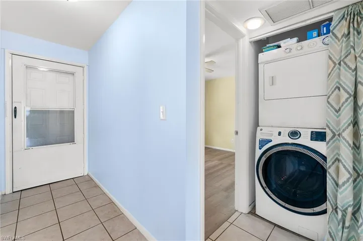 Stackable washer and dryer in hallway