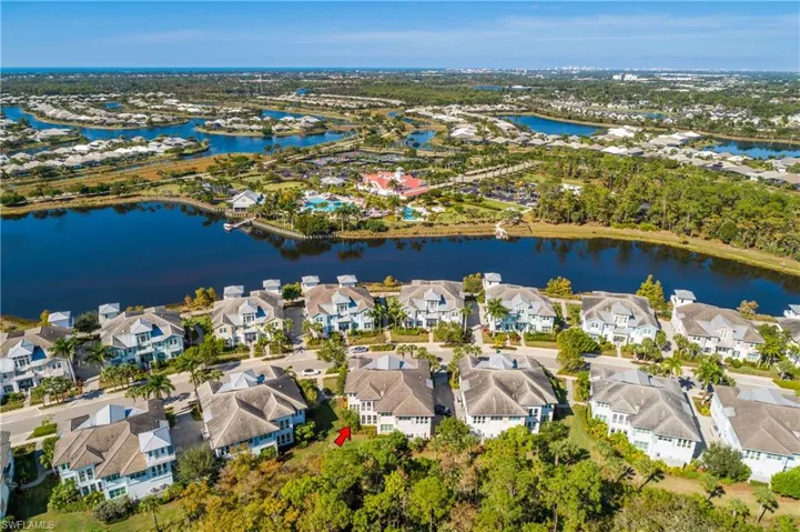 Aerial view of residential area featuring a large body of water
