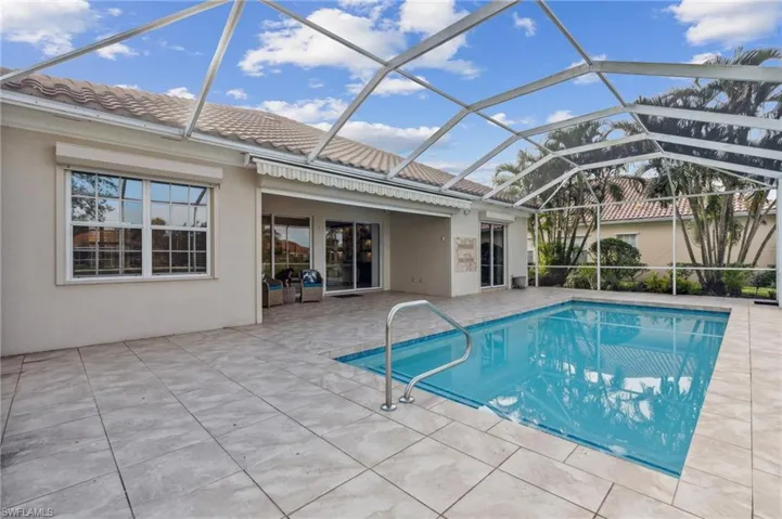 View of pool featuring a lanai and a patio area