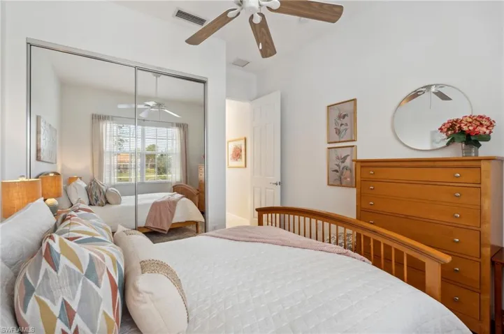 Bedroom with ceiling fan and a closet
