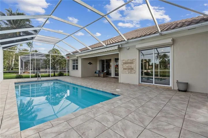 View of pool featuring a patio and a lanai