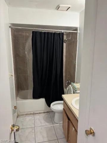 Full bath featuring vanity and shower / tub combo