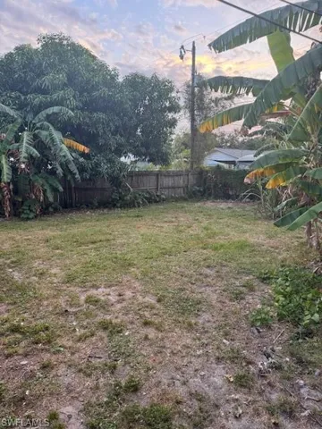 View of yard at dusk