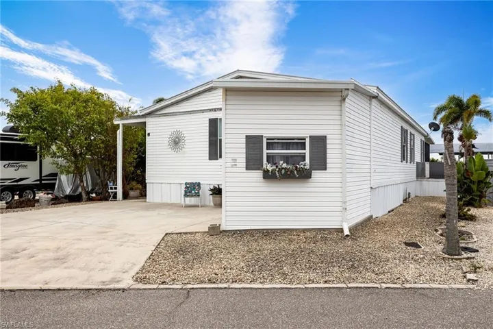 View of front of home featuring attached utility room