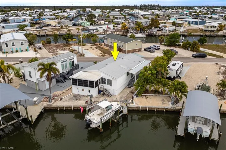 Aerial view of rear of home on canal