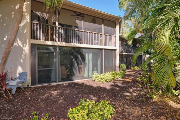 Back of house featuring screened lanais