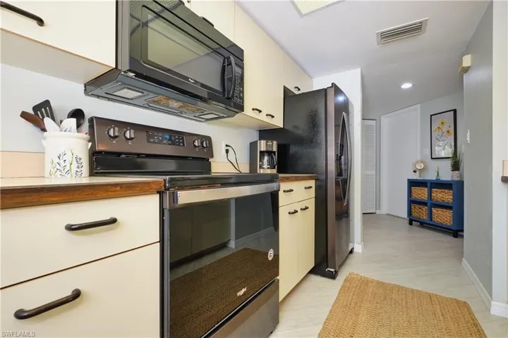 Kitchen featuring plenty of counter space, appliances with stainless steel finishes, and recessed lighting