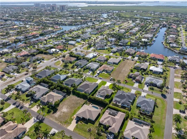 View of property location with nearby suburban area and a large body of water