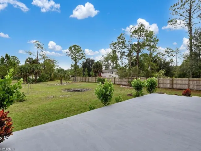 Fenced backyard featuring a patio