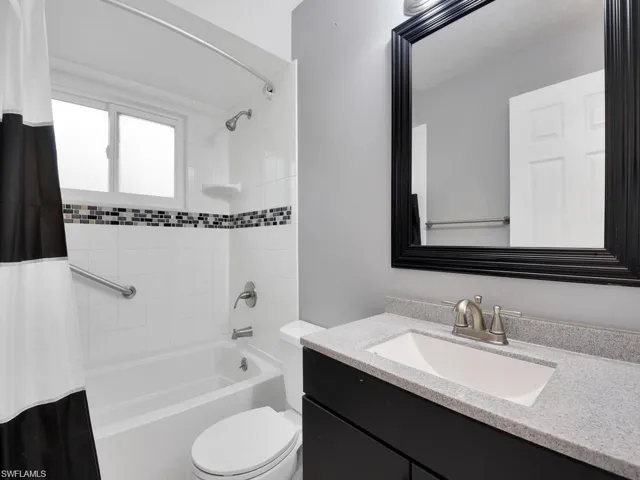 Bathroom with vanity and shower / bath combo