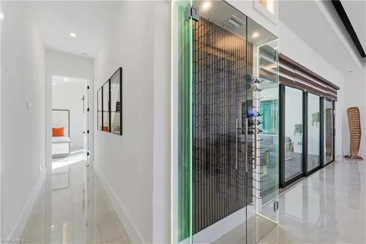 Wine cellar featuring baseboards and recessed lighting