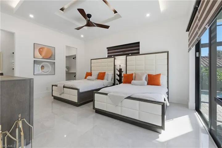 Bedroom with a ceiling fan and access to outside