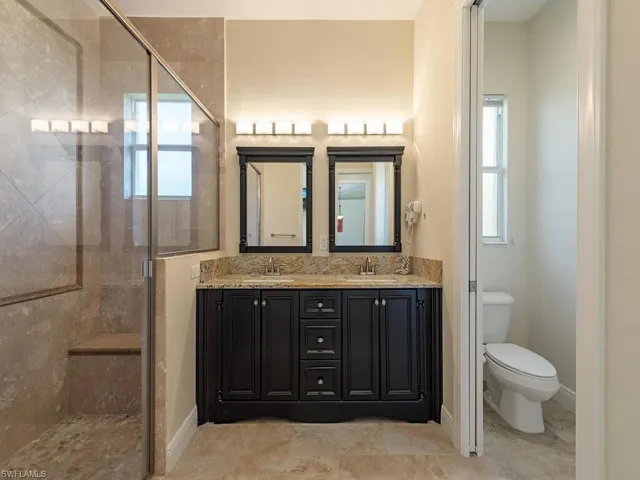 Master bath with dual sinks and walk in shower