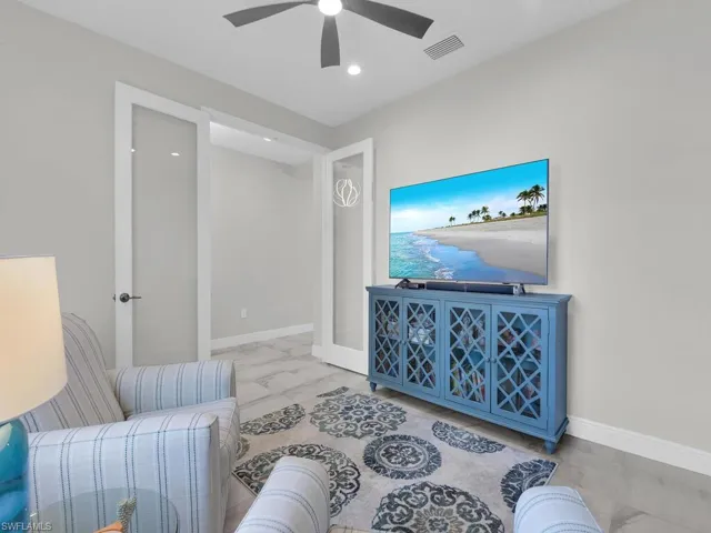 Sitting room with baseboards and recessed lighting