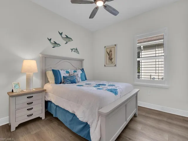 Bedroom featuring wood finished floors and ceiling fan
