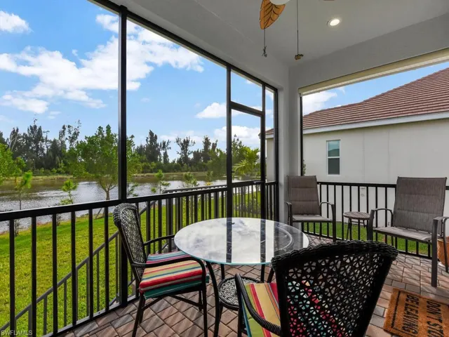 Sunroom with a water view