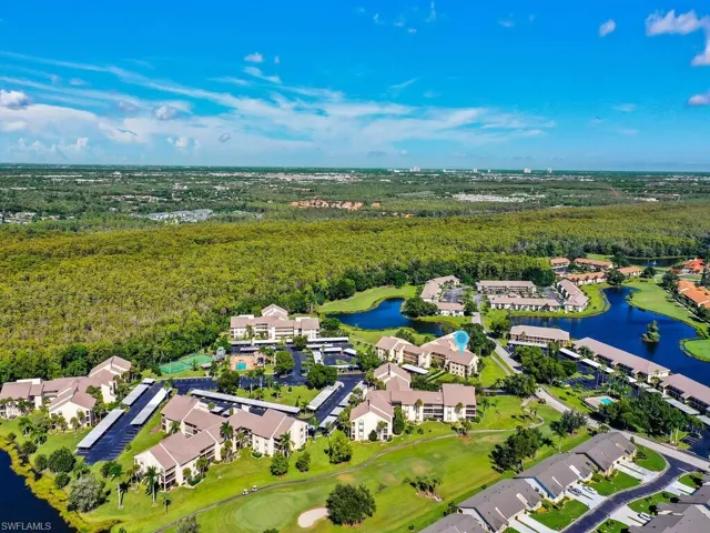 Aerial perspective of suburban area with a nearby body of water