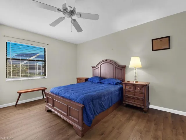 Bedroom with wood-type flooring and ceiling fan
