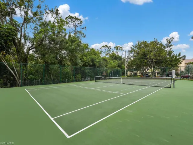 View of tennis court with community basketball court
