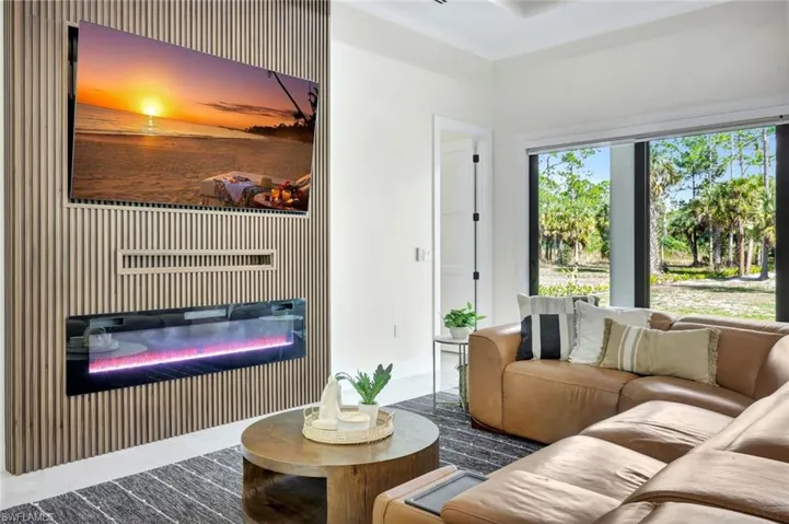 Living area with a glass covered fireplace