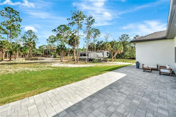 View of patio featuring view of scattered trees