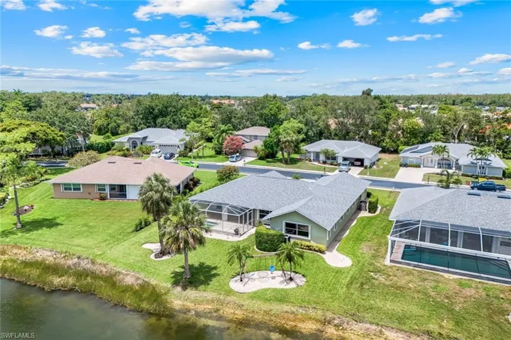 Aerial perspective of suburban area with a nearby body of water