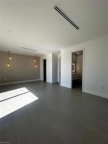 Unfurnished room featuring baseboards