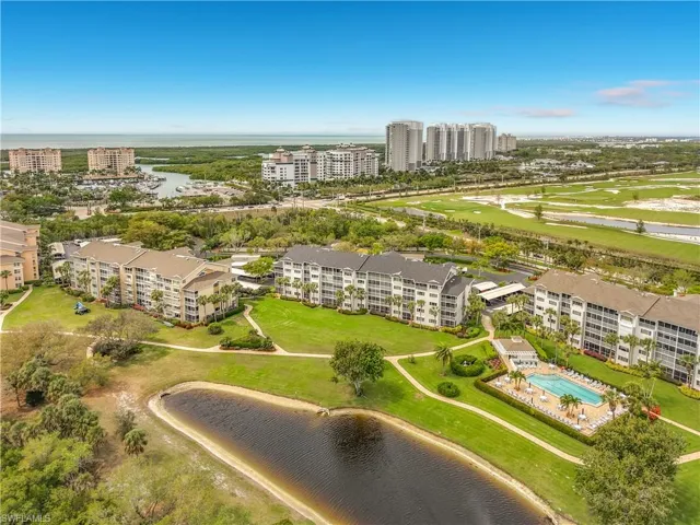 Bird's eye view of a nearby body of water and a golf course