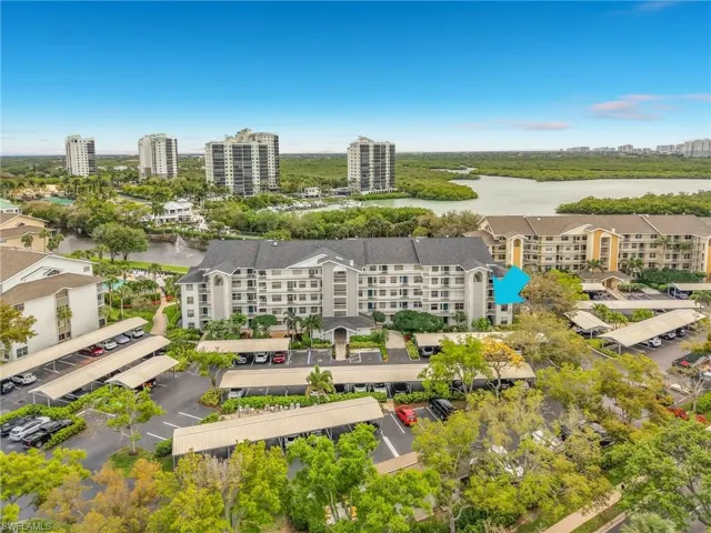 View of urban area with apartment complex / building and a large body of water
