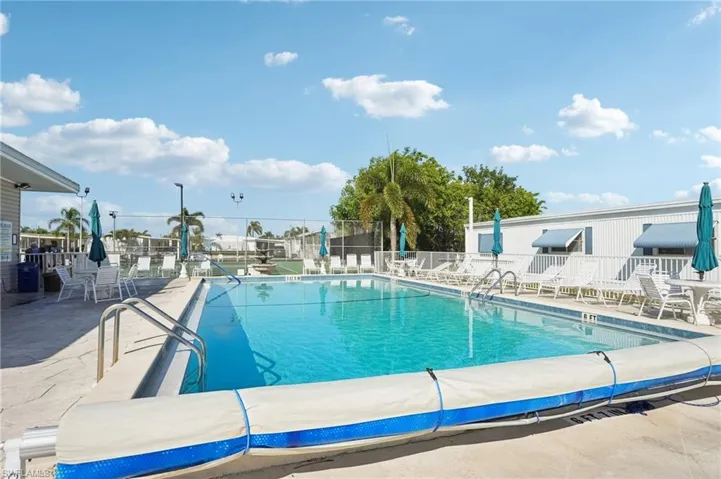 Community pool with a patio