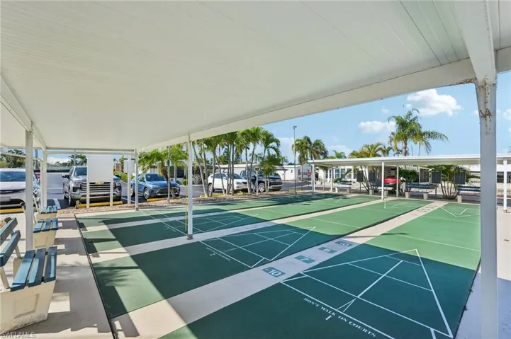 View of community featuring shuffleboard