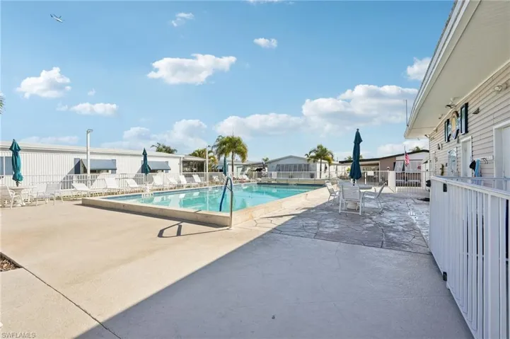 Community pool with a patio area